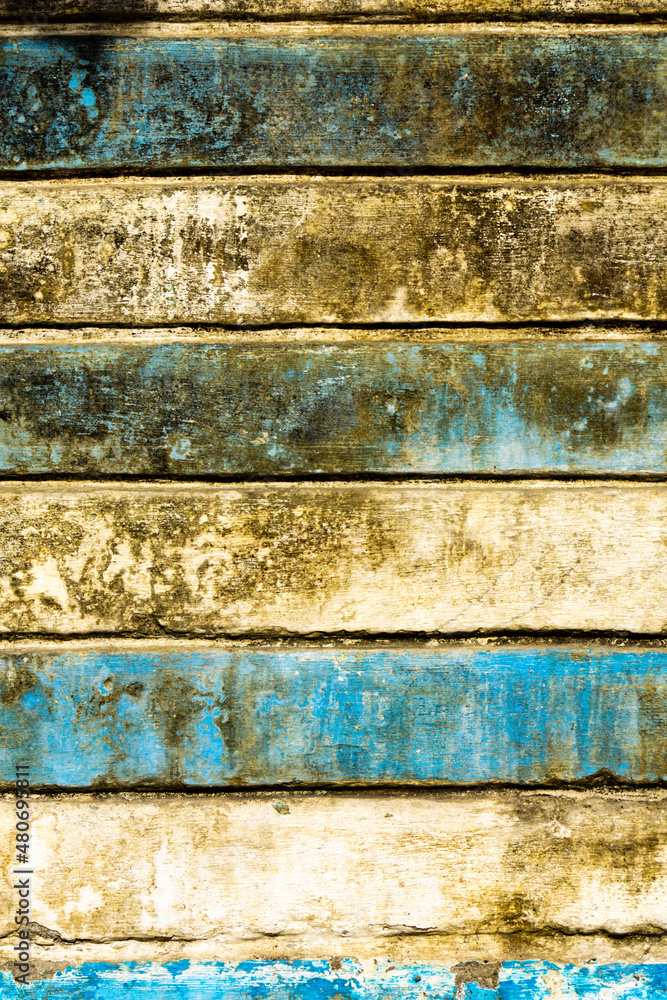 Fototapeta premium Old and dirty white blue horizontal striped wall in grunge style