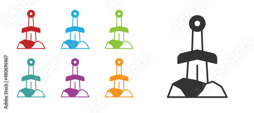 Black Sword in the stone icon isolated on white background. Excalibur the sword in the stone from the Arthurian legends. Set icons colorful. Vector