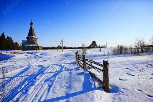 wooden church in the Russian north landscape in winter, architecture historical religion Christianity photo