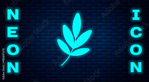 Glowing neon Movie trophy icon isolated on brick wall background. Academy award icon. Films and cinema symbol. Vector