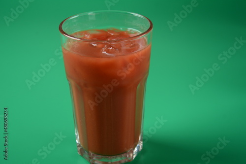 Wallpaper Mural Full glass of fresh tomato juice with cherry tomatoes around . Very tasty and healthy tomato juice with ice cubes Torontodigital.ca