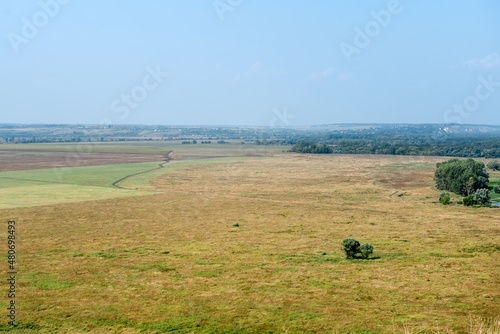 Top view of agricultural fields and the country road through them photo