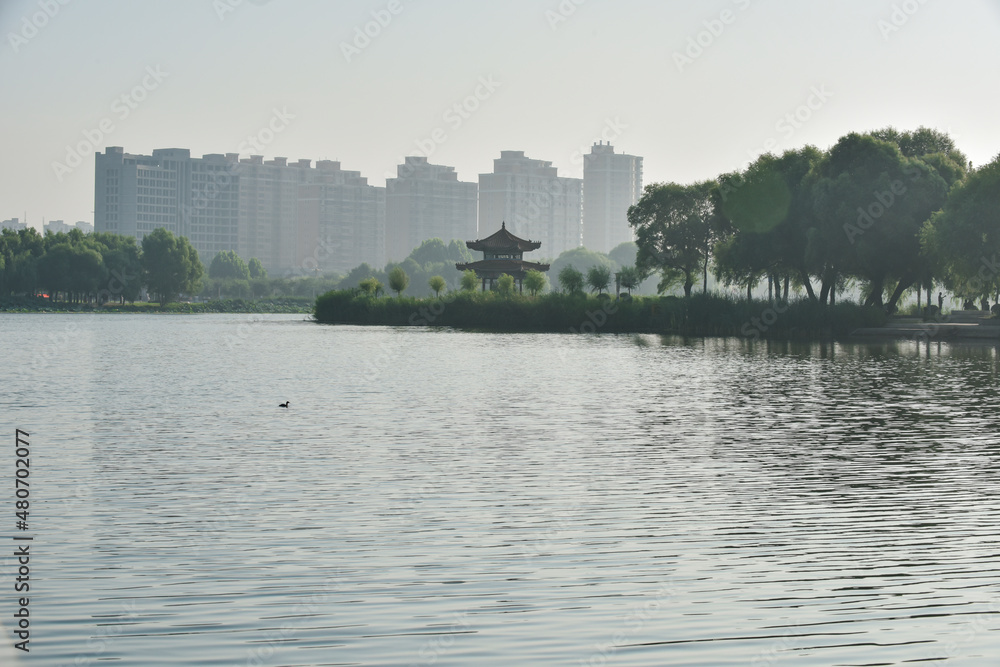 Fototapeta premium Hetang plank road and waterfront city skyline in urban park