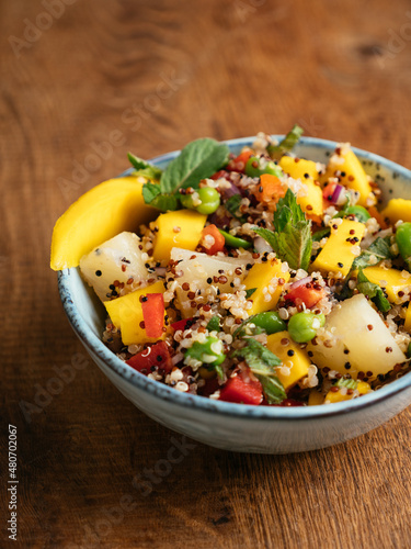 Tropical quinoa salad with mango, pineapple and fava beans.