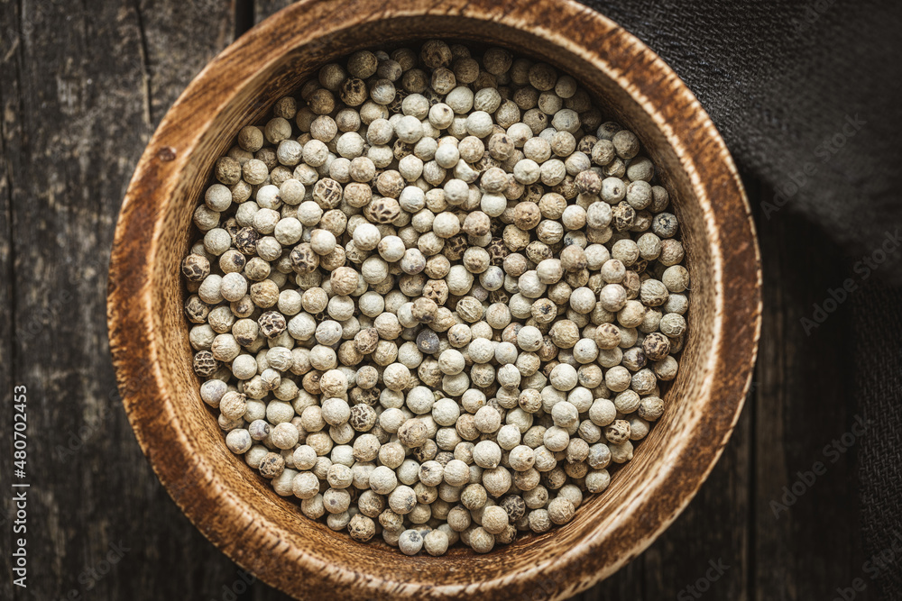 Whole pepper spice. White peppercorn grain in bowl Whole pepper spice. White peppercorn grain in bowl