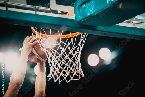basketball game ball in hoop photo