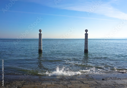 Two stone pillars against the ocean on the beach in Lisbon, Portugal, Сais das Сolunas