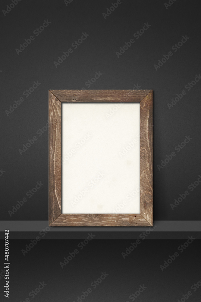 Wooden picture frame leaning on a black shelf. 3d illustration. Vertical background Wooden picture frame leaning on a black shelf. 3d illustration. Vertical background