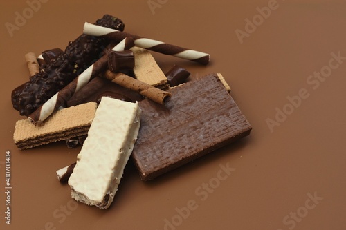 Chocolate sweets on brown background