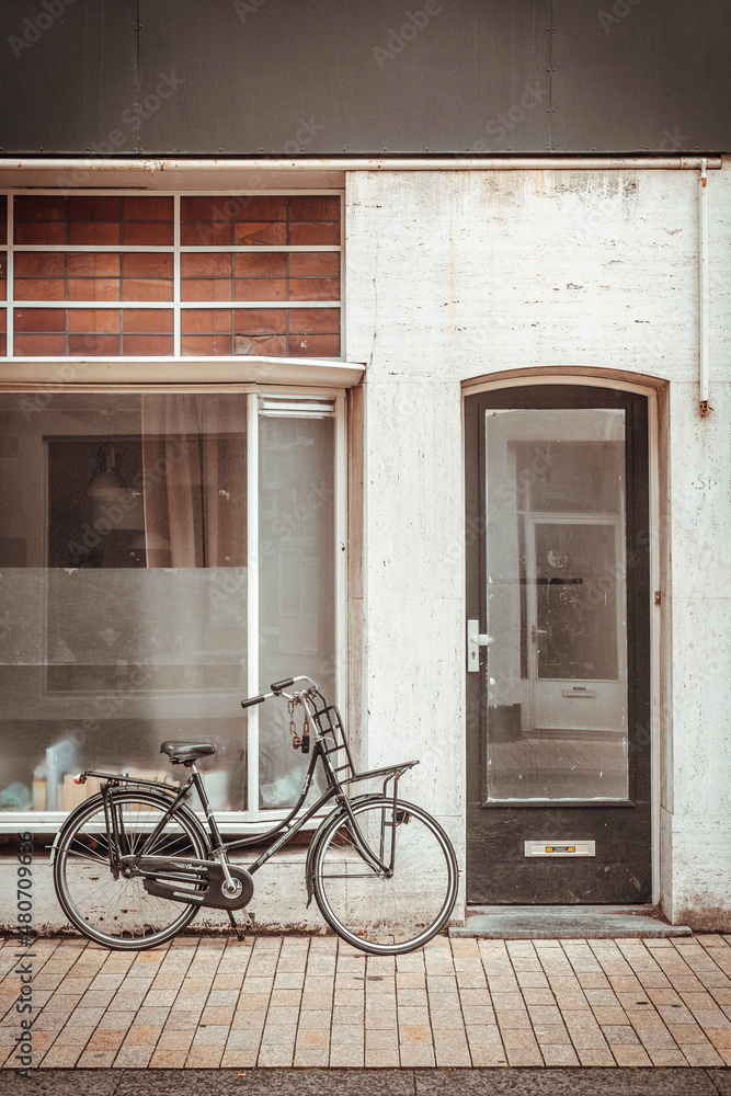 Old bicycle in front of a brick wall Old bicycle in front of a brick wall