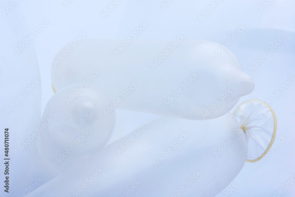 Fototapeta premium Condoms in white