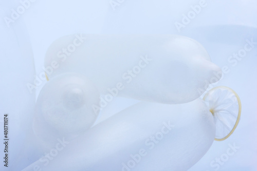 Condoms in white