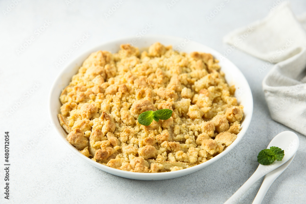 Traditional homemade crumble dessert with fresh mint Traditional homemade crumble dessert with fresh mint