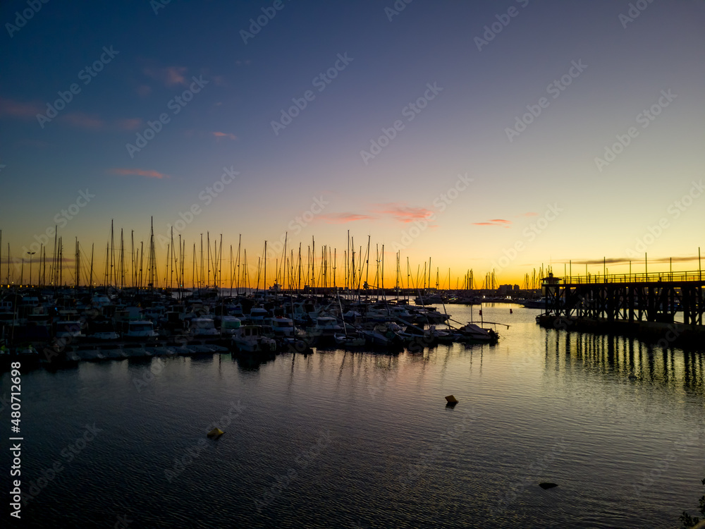 Fototapeta premium The Mediterranean Sea. Sea marina for yachts in the evening, the sun sets.