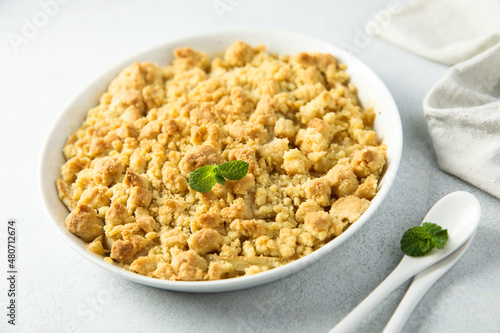 Traditional homemade crumble dessert with fresh mint