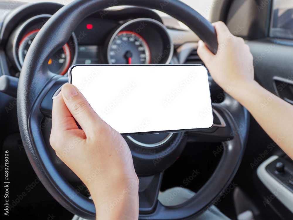 woman using phone while driving with one hand