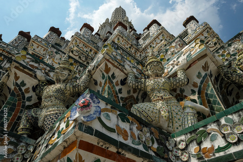 Bangkok, Thailand - January 2022: Detail of a statue in the Wat Arun Buddhist temple located on the banks of the Chao Phraya River on January 16, 2022 in Bangkok, Thailand.