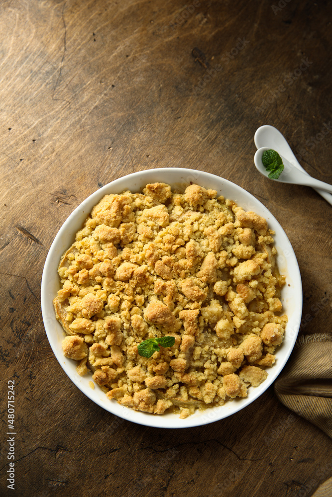 Traditional homemade crumble dessert with fresh mint Traditional homemade crumble dessert with fresh mint