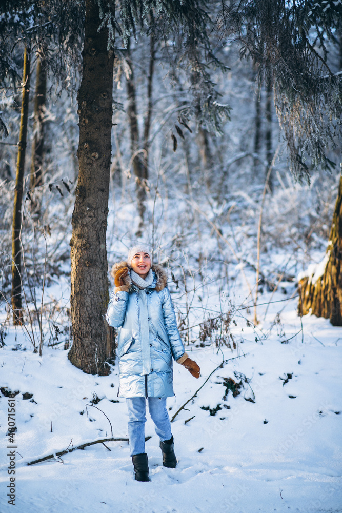 Woman happy walking in a winter park