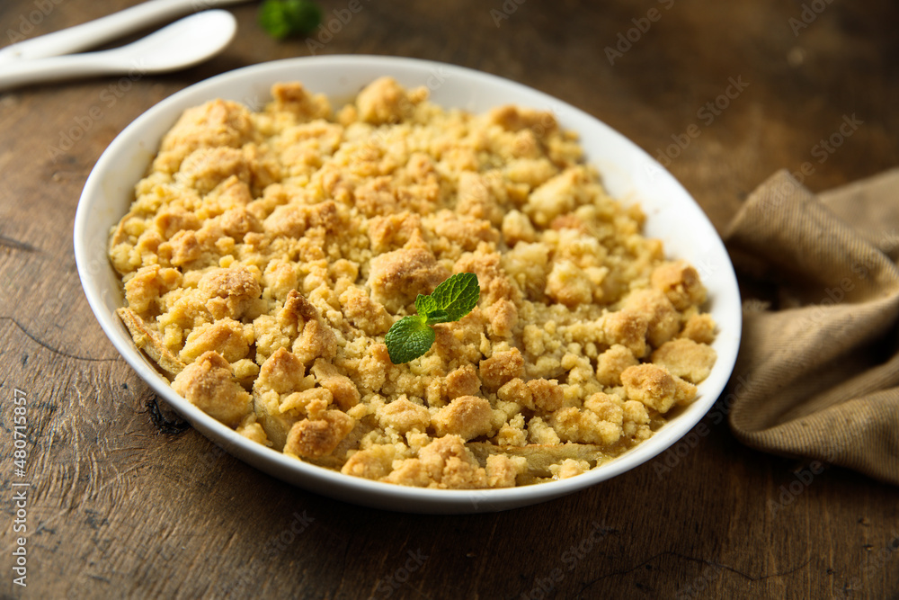 Traditional homemade crumble dessert with fresh mint Traditional homemade crumble dessert with fresh mint