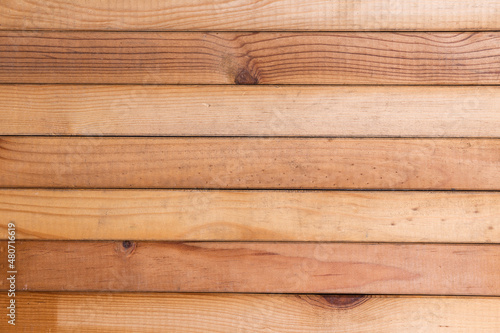 Background of pine wood boards forming linear straight lines, goemetry concept photo