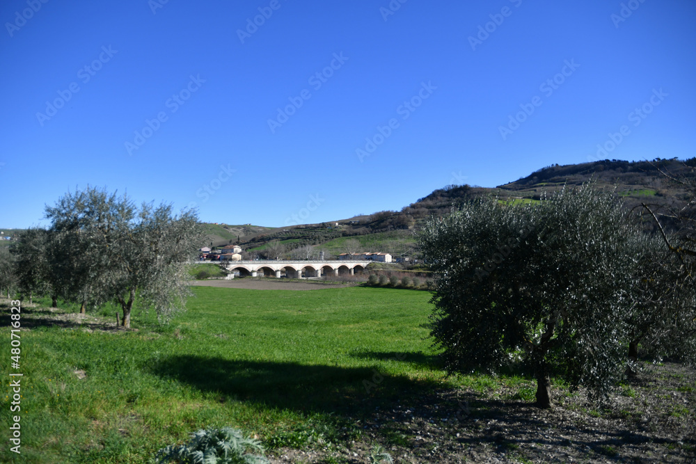 An old bridge in the countryside of Buonalbergo, a mountain village in the province of Benevento, Italy. An old bridge in the countryside of Buonalbergo, a mountain village in the province of Benevento, Italy.