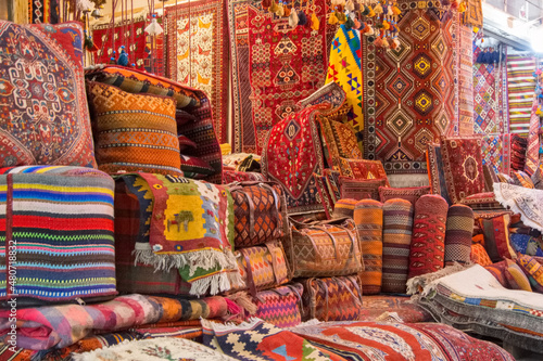 Carpets and gabbehs at a market in Iran photo
