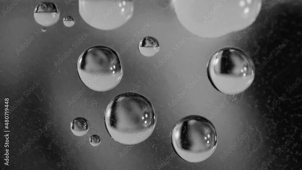 Drops on ice. Frozen water. Macro shooting. Black and white image.