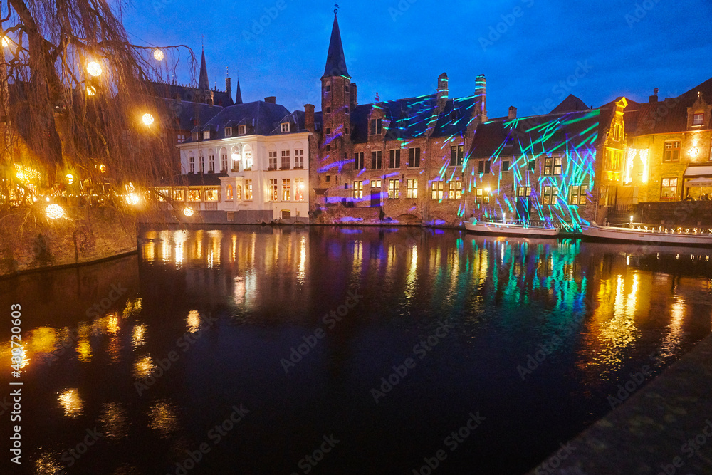 Fototapeta premium Canals in the evening light in the historic city centre of Bruges in Belgium