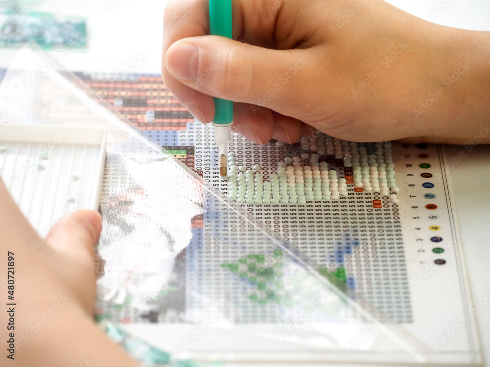 The process of creating a picture of rhinestones, mosaic.To practice at home.Hobby. The process of creating a picture of rhinestones, mosaic.To practice at home.Hobby.