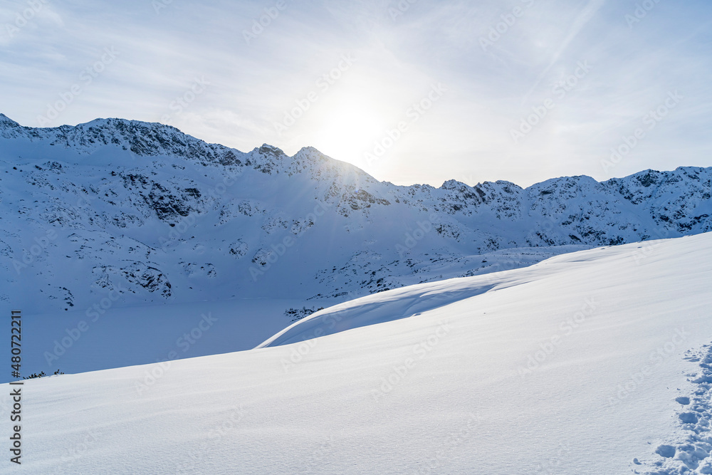 Obraz premium Mountain winter landscape in the Tatras, mountain view covered with snow in frosty sunny weather