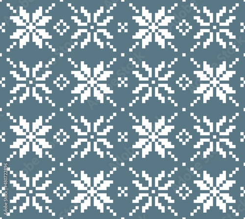 Scandinavian knitting seamless pattern design. Nordic star pattern  in white and blue.