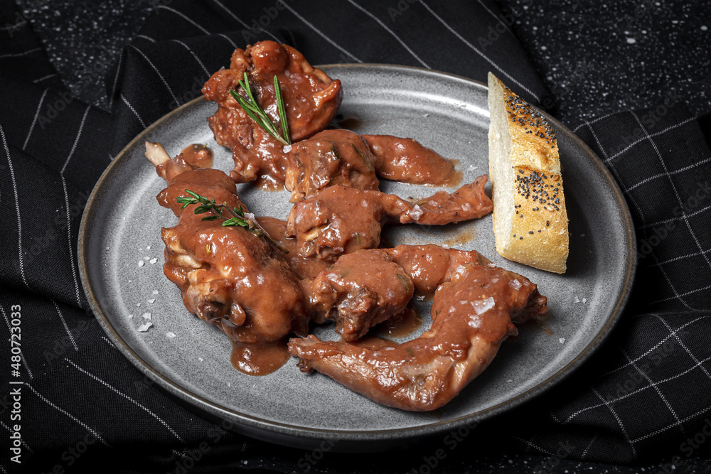Traditional rabbit meat stew with red wine sauce Traditional rabbit meat stew with red wine sauce
