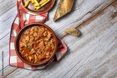 Fototapeta Traditional homemade and typical tripe recipe Madrid style with bread and French