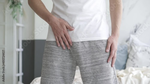 Male fertility concept, pain in prostate, man suffering from prostatitis or from a venereal disease at home, urological genital infections