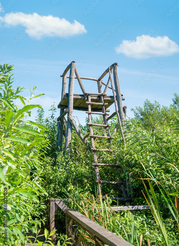 Viewpoint bird watching tower over the delta in Comana Natural park, in Romania. Viewpoint bird watching tower over the delta in Comana Natural park, in Romania.