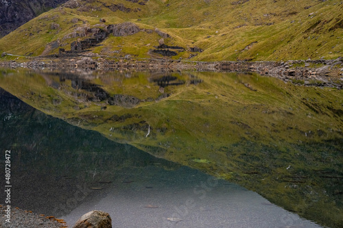 Reflection of snowdon mountain in lake 