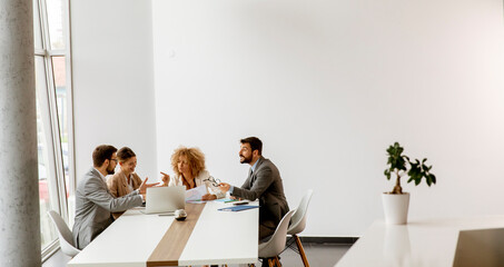 Multiethnic young business people working together in the office
