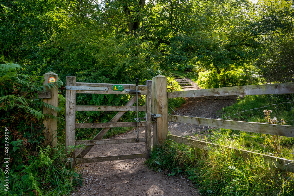 A gate on a walking path in the Derbyshire Peak District on an English summers day