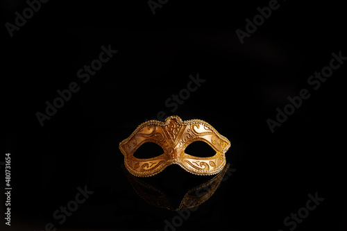 Luxury venetian mask on dark glitter background. Carnival masquerade fantasy mask