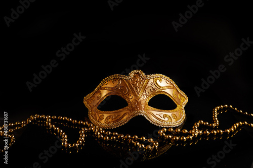 Luxury venetian mask on dark glitter background. Carnival masquerade fantasy mask photo