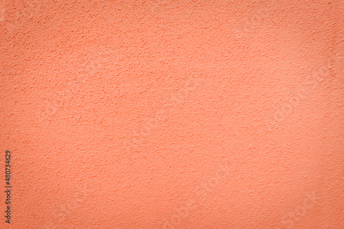 Orange abstract background. Painted orange color wall stucco texture. 