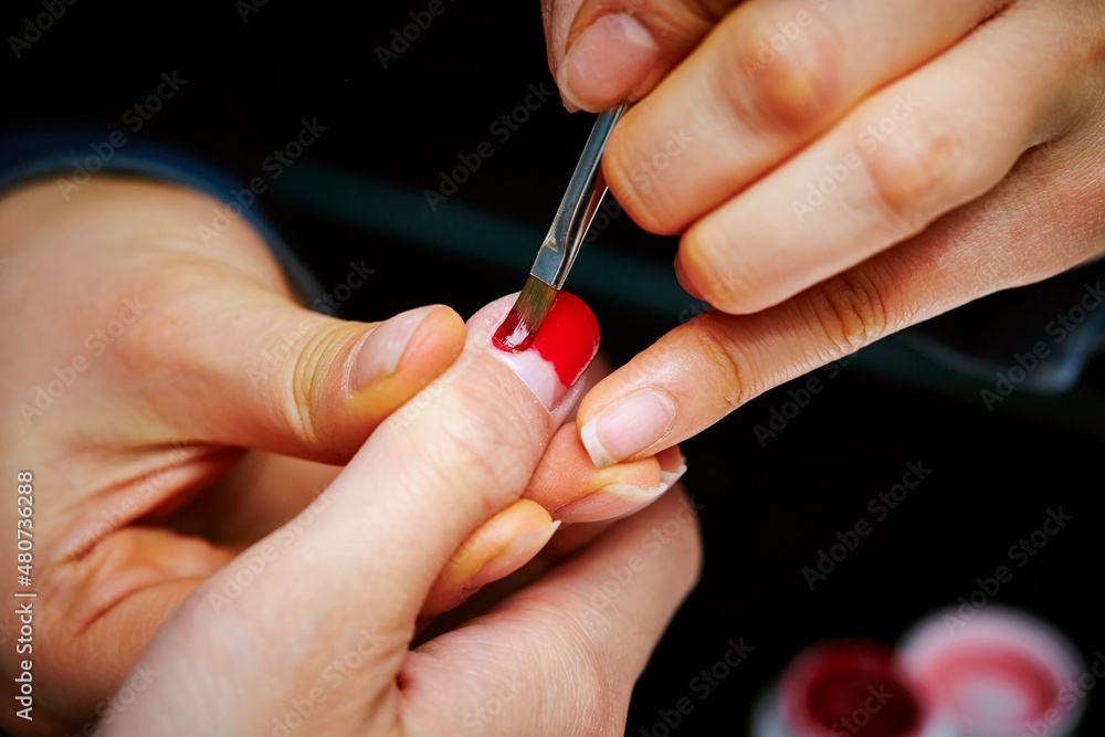 Nail art, close-up of hands trimming nails Nail art, close-up of hands trimming nails