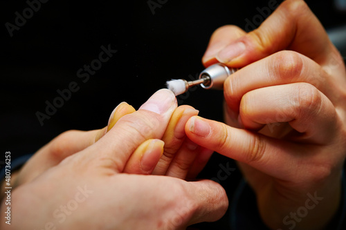  Nail art  close-up of hands trimming nails