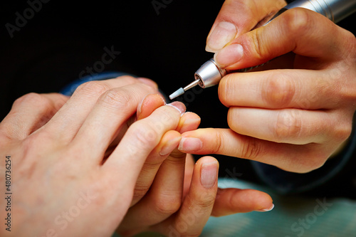  Nail art  close-up of hands trimming nails