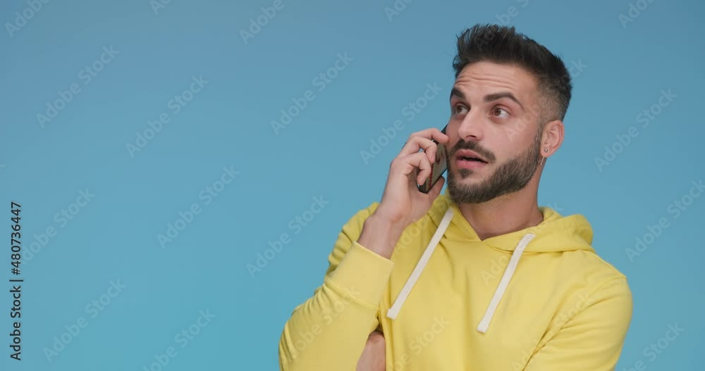 attractive casual man texting on his phone then answering a call, talking and feeling shocked, pointing at himself and gesturing call me attractive casual man texting on his phone then answering a call, talking and feeling shocked, pointing at himself and gesturing call me