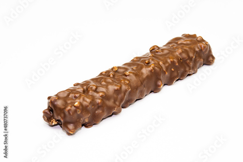 Wafers, cookies and sweets concept with hazelnut and chocolate. Cracked chocolate bar with snack wafers.