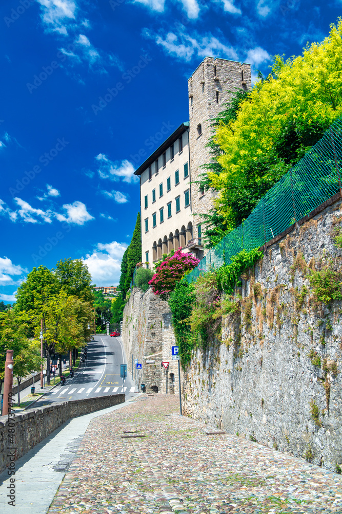 Bergamo Alta walls and road on a sunny day, Italy.