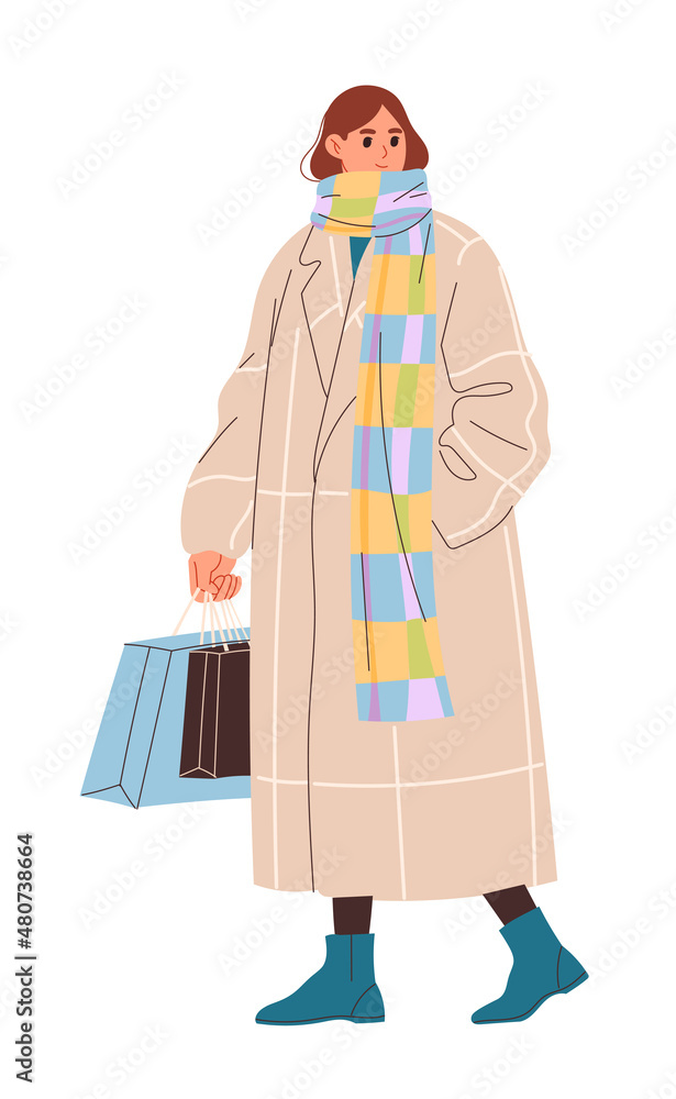 Young woman in long beige coat going shopping from store