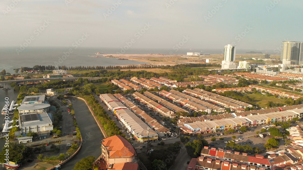 Malacca, Malaysia. Aerial view of city homes and skyline from drone on a clear sunny day.